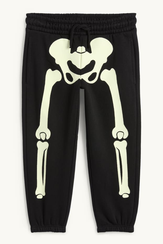 Kinderen: jongens - Halloween - skelet - joggingbroek - glow in the dark - zwart