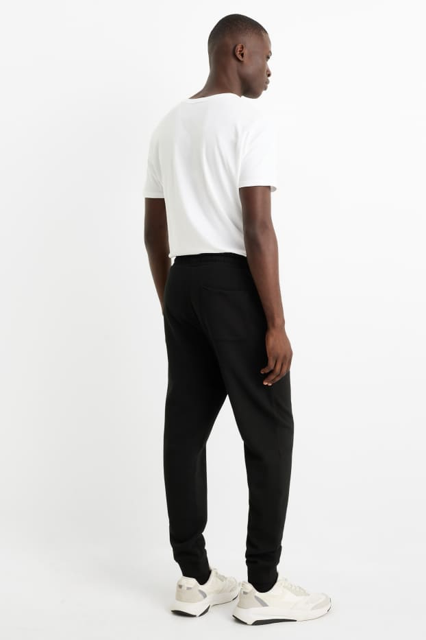 Pánské - Teplákové kalhoty - černá