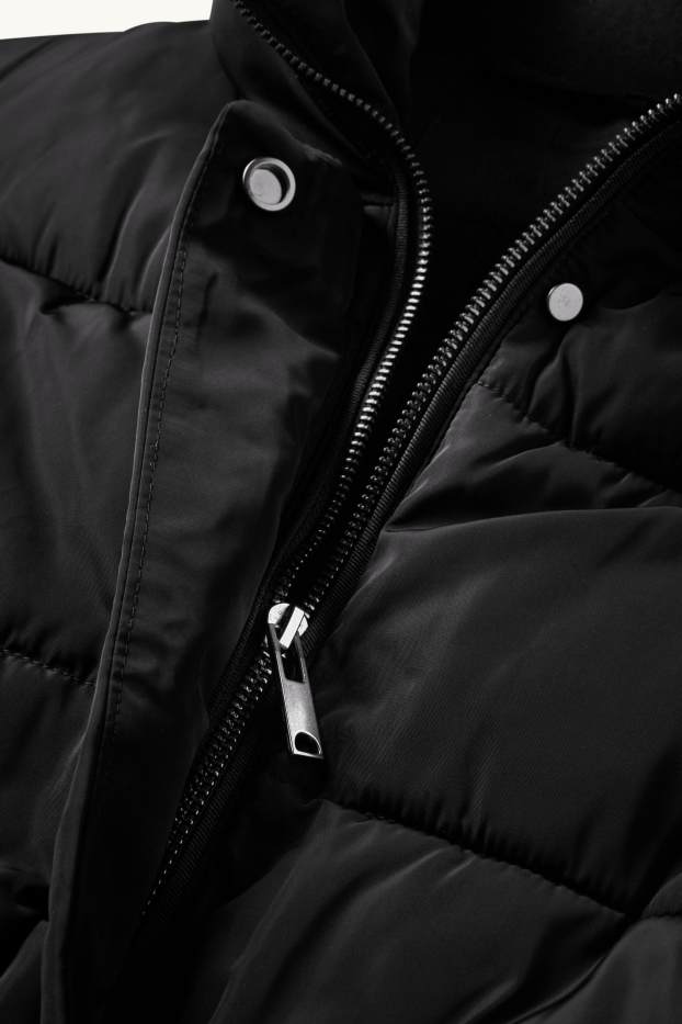 Damen - Steppweste mit Gürtel - schwarz