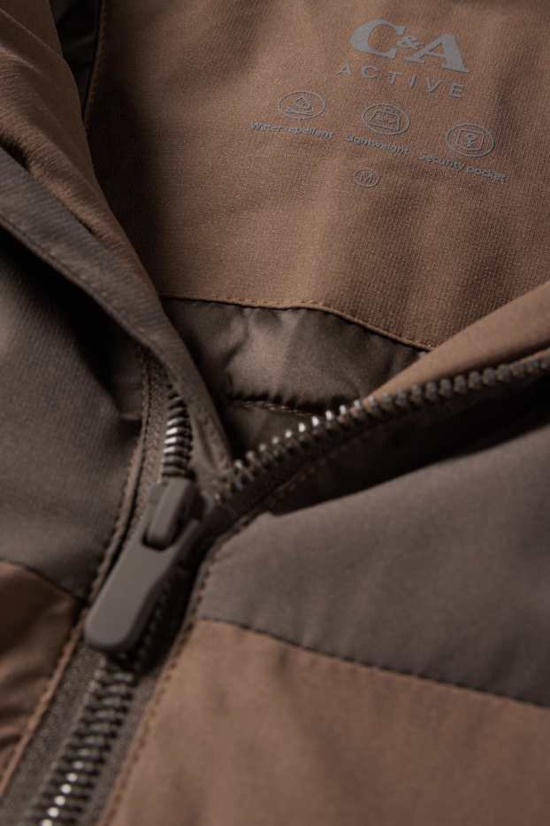 Home - Jaqueta tècnica amb caputxa - folrada - impermeable - marró