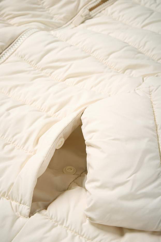 Dámské - Prošívaný kabát s kapucí - krémové barvy