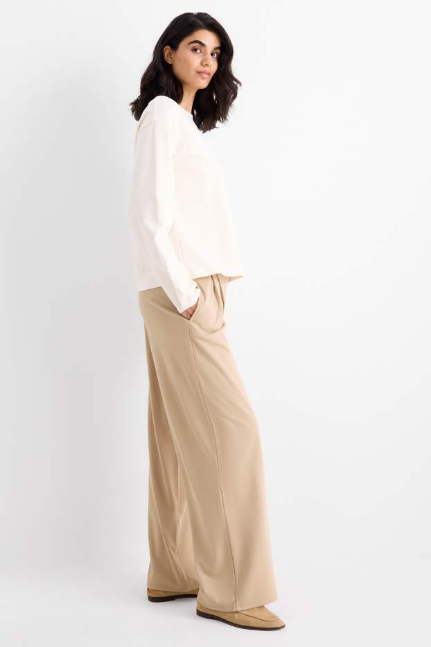 Dámské - Žerzejové kalhoty - high waist - wide leg - béžová