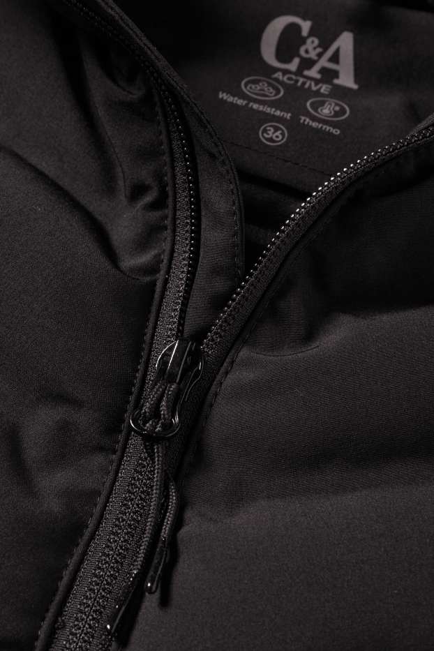 Femmes - Veste de sport chaude à capuche - finition déperlante - noir