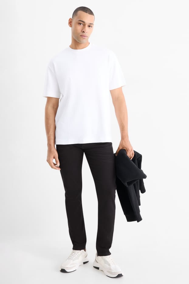 Bărbați - Slim tapered jeans - negru