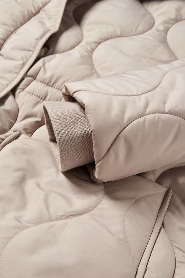 Femmes - Doudoune longue à capuche - beige