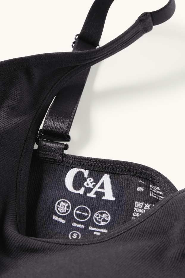 Dámské - Sportovní podprsenka - s vycpávkami - žebrovaná - bezešvá - černá