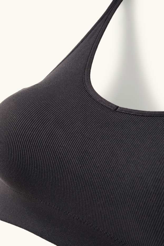Dámské - Sportovní podprsenka - s vycpávkami - žebrovaná - bezešvá - černá