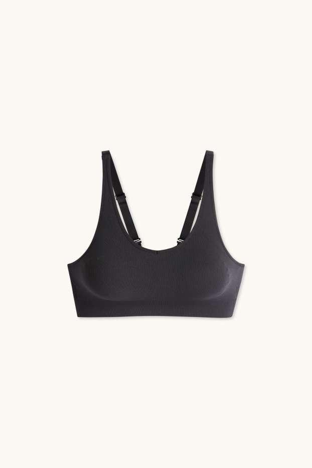 Dámské - Sportovní podprsenka - s vycpávkami - žebrovaná - bezešvá - černá