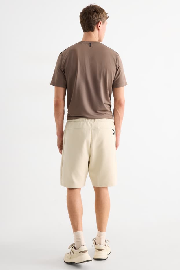 Bărbați - Pantaloni scurți de trening - structurați - bej deschis