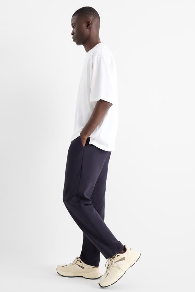 Uomo - Pantaloni chino - tapered fit - blu scuro
