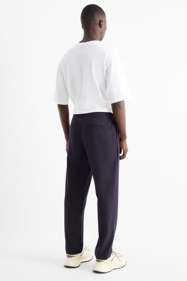 Uomo - Pantaloni chino - tapered fit - blu scuro