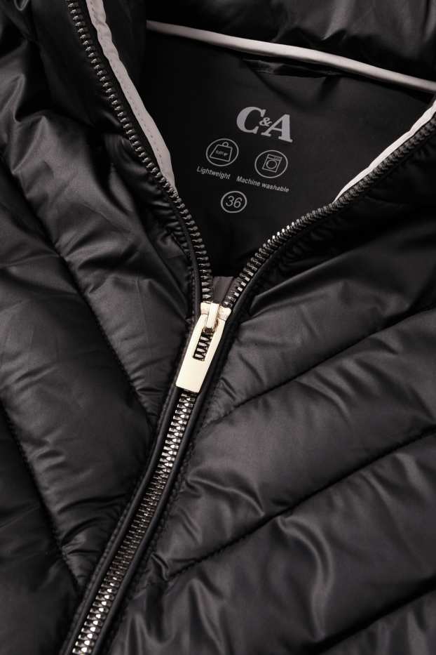 Dona - Jaqueta embuatada amb caputxa - negre