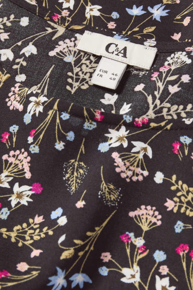 Dona - Brusa - de flors - negre