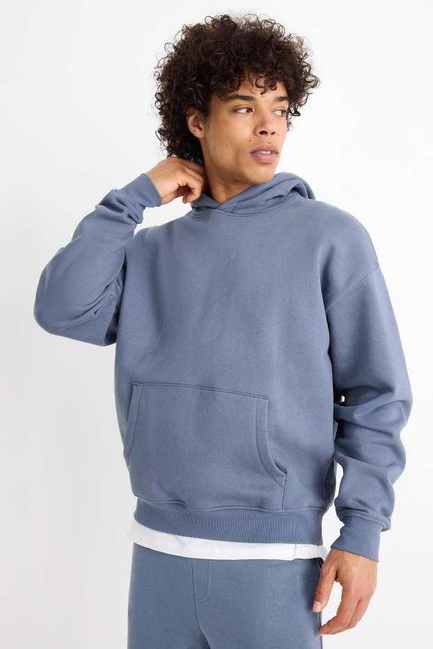 Home - Dessuadora oversized amb caputxa - blau