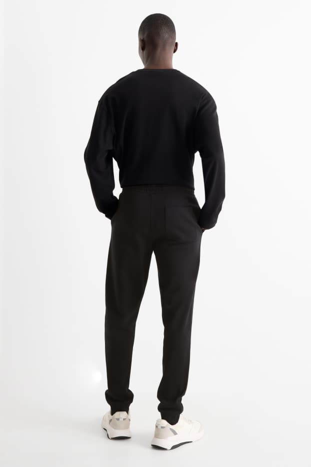 Hommes - Pantalon de jogging - noir