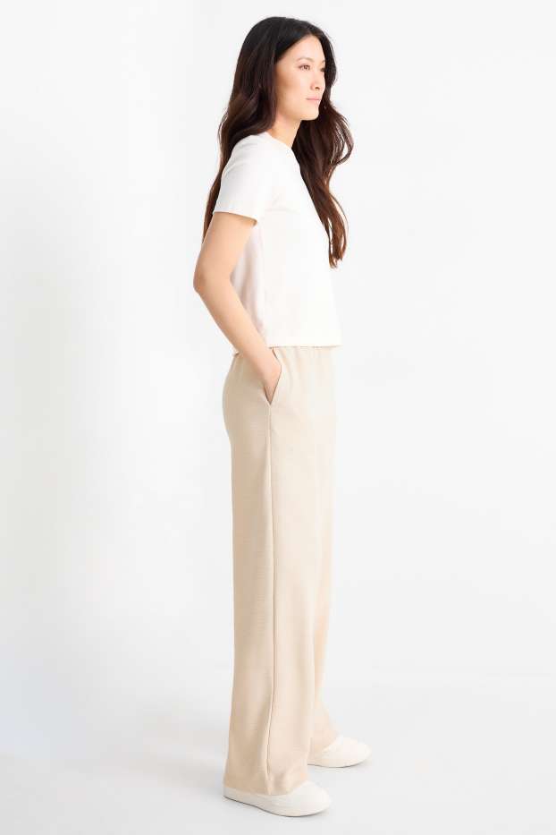 Femmes - Pantalon en jersey - mid waist - regular fit - finition texturée - beige clair