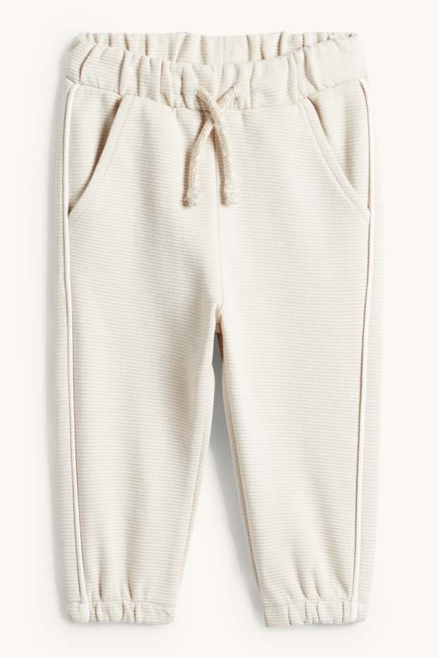 Nadó nen - Dinosaure - conjunt per a nadó - acanalat - 2 peces - beix