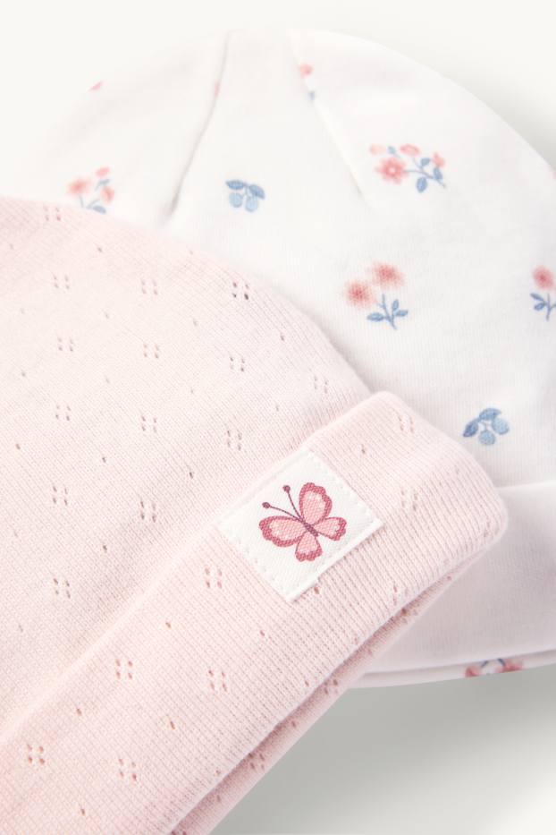 Bébés filles - Lot de 2 - petits fleurs et papillon - bonnet bébé - blanc / rose
