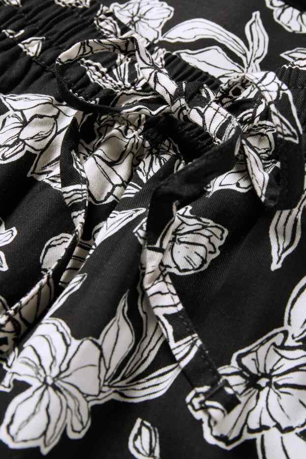 Women - Cloth trousers - high waist - tapered fit - floral - black / white