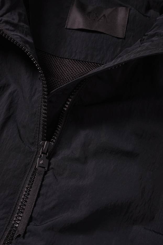 Dames - Jas met capuchon - waterafstotend - zwart