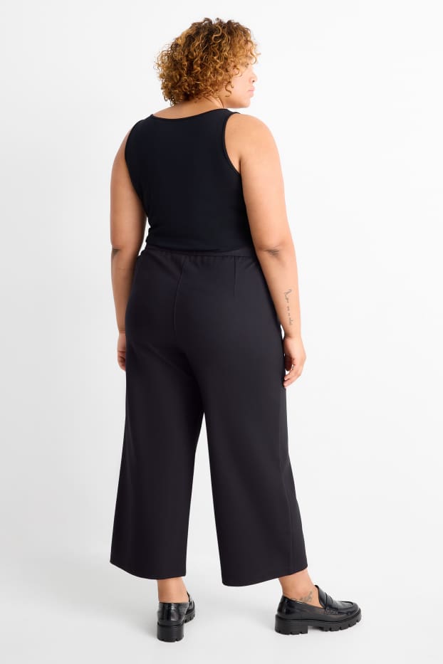 Dámské - Žerzejové kalhoty s páskem - high waist - wide leg - černá