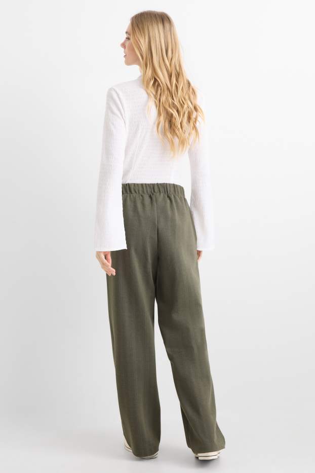 Dámské - Žerzejové kalhoty - mid waist - wide leg - s úzkými proužky - zelená