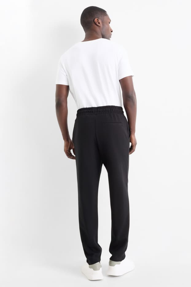 Bărbați - Pantaloni de trening - negru