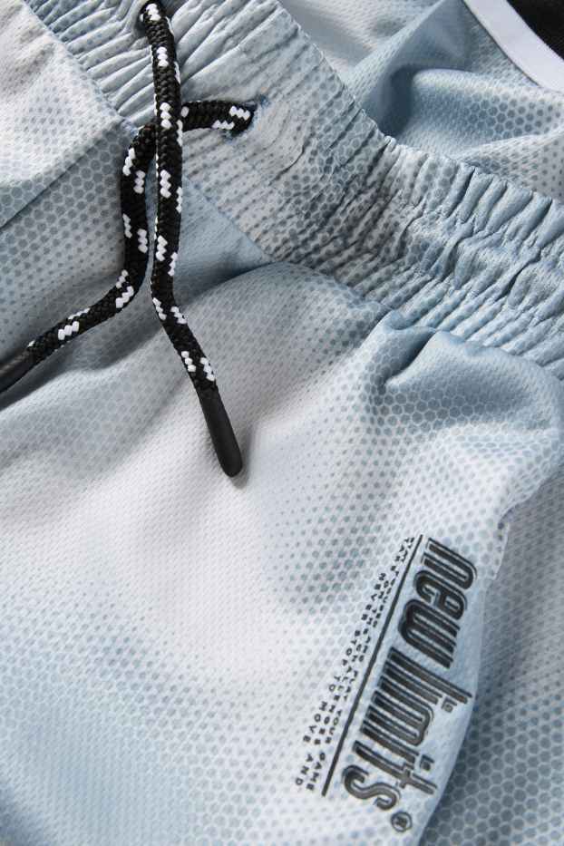 Kinderen: jongens - Sportshort - met patroon - lichtturquoise