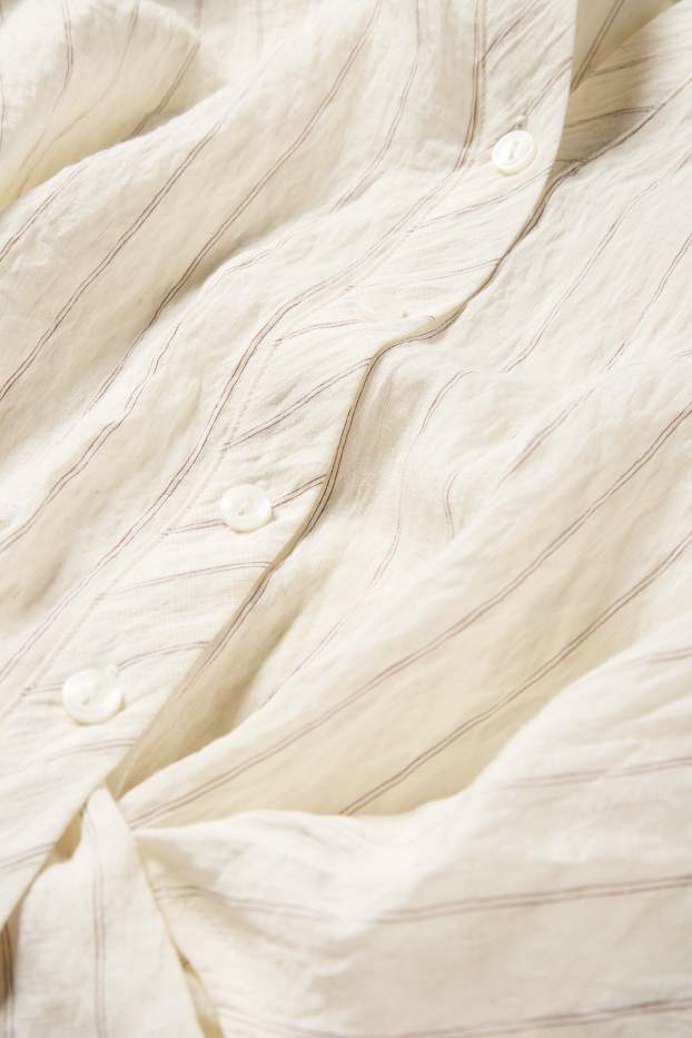 Dames - Blouse met knoop in de stof - gestreept - crème wit