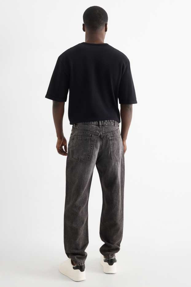 Heren - Relaxed tapered jeans, deels met linnen. - zwart