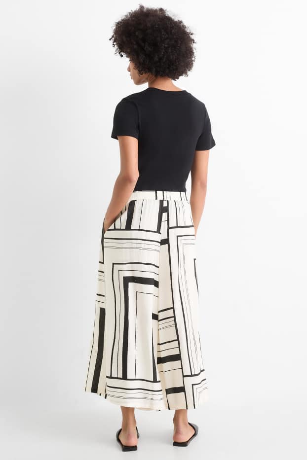 Dona - Pantalons culotte - high waist - wide leg - estampats - negre/beix