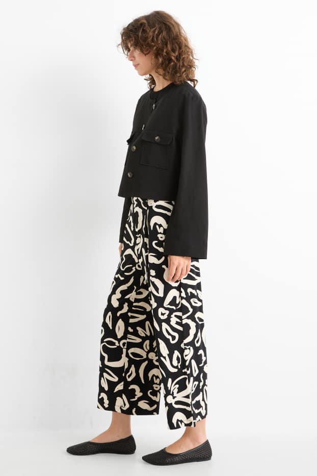 Donna - Pantaloni in jersey - vita media - straight fit - a fiori - nero / beige