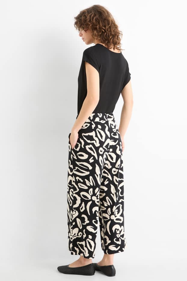 Donna - Pantaloni in jersey - vita media - straight fit - a fiori - nero / beige