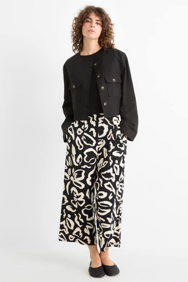 Donna - Pantaloni in jersey - vita media - straight fit - a fiori - nero / beige