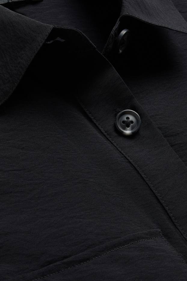 Femmes - Gilet sans manches - finition texturée - noir