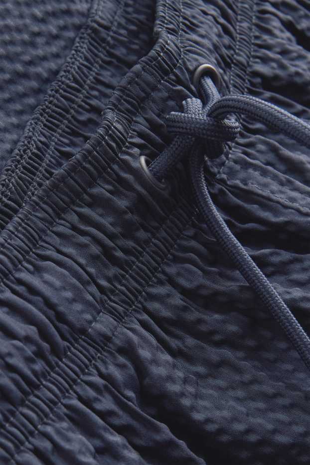 Hommes - Short de bain - finition texturée - bleu foncé