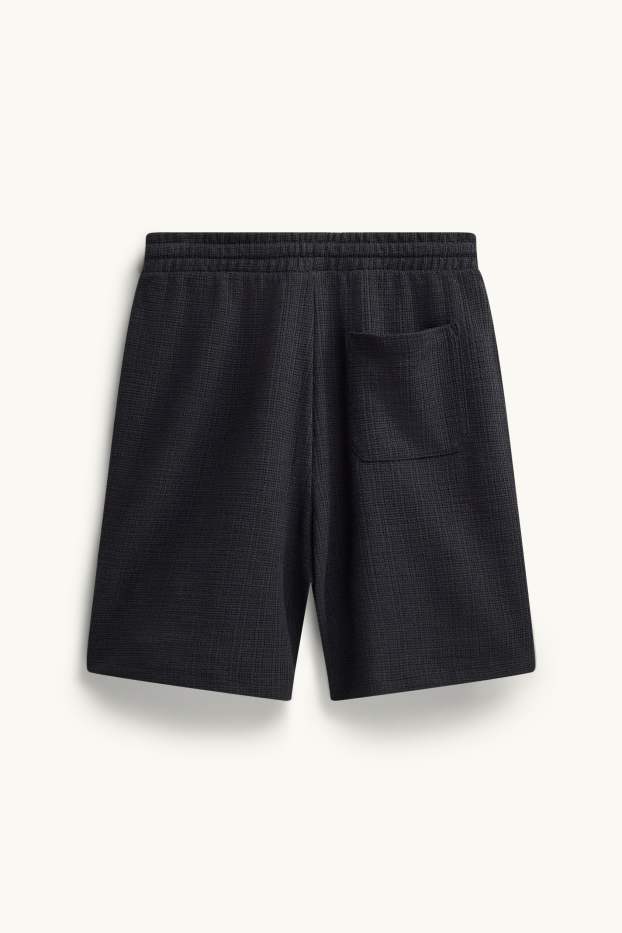 Bărbați - Pantaloni scurți de trening - structurați - negru