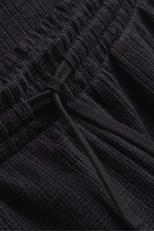 Bărbați - Pantaloni scurți de trening - structurați - negru