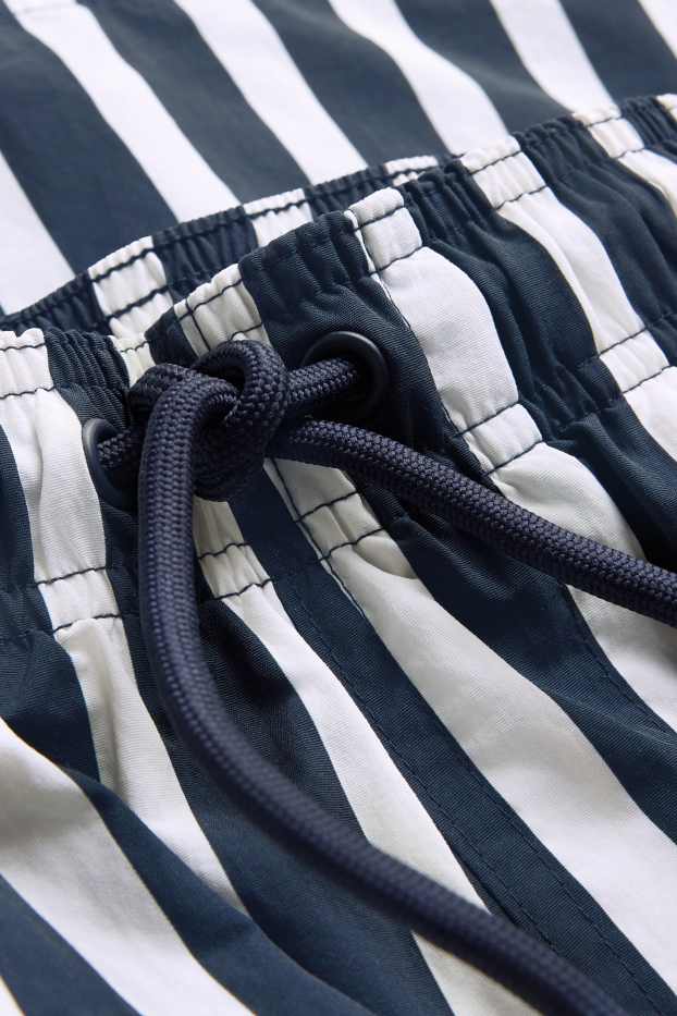 Men - Swim shorts - striped - dark blue / white