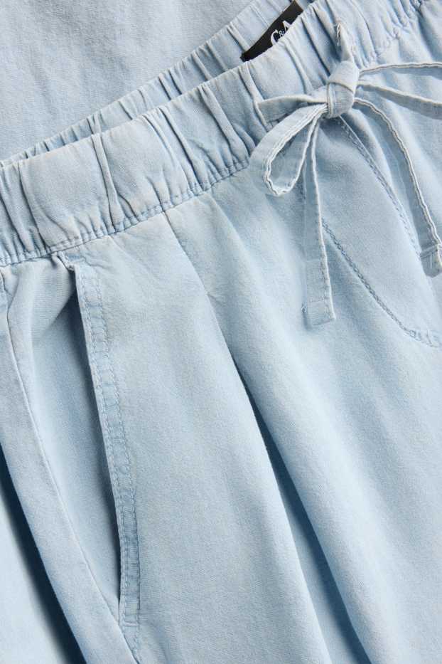 Dona - Pantalons de tela - mid waist - palazzo - blau clar