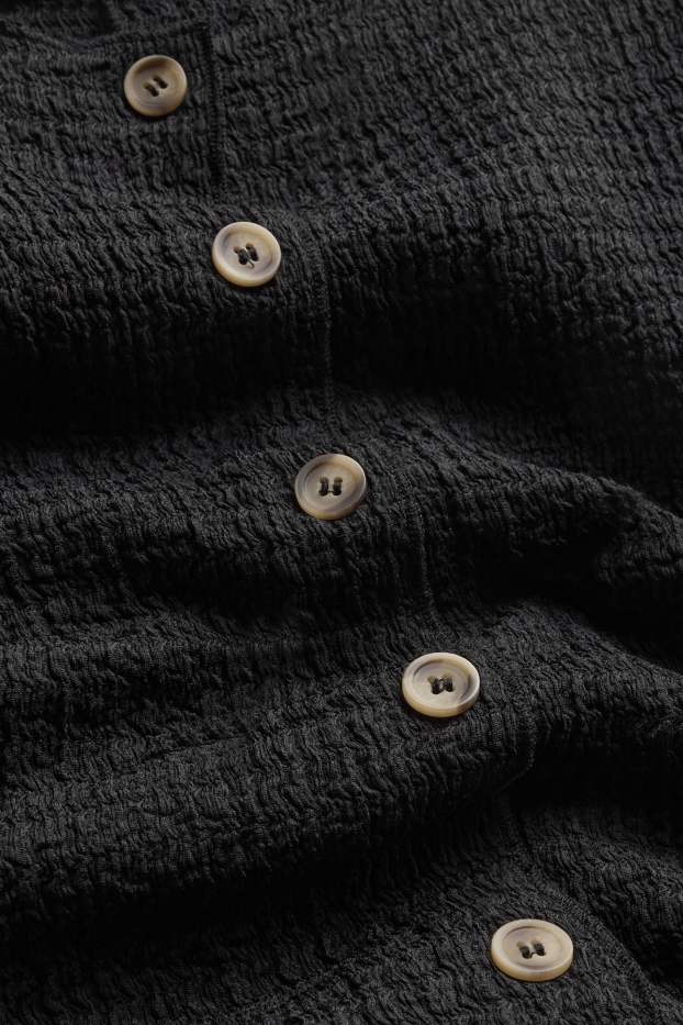 Femmes - Caraco - finition texturée - noir