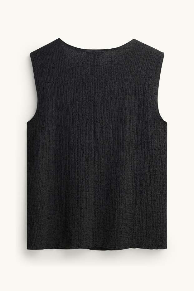 Femmes - Caraco - finition texturée - noir