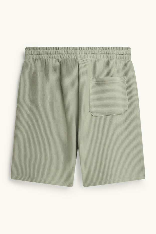Uomo - Shorts - tessuto tramato - verde