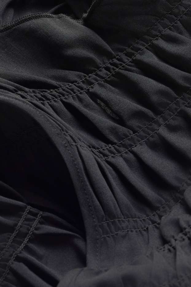 Femmes - Chemisier - finition smockée - noir