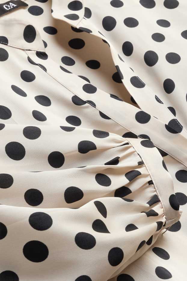 Damen - Bluse mit V-Ausschnitt - gepunktet - weiß / schwarz