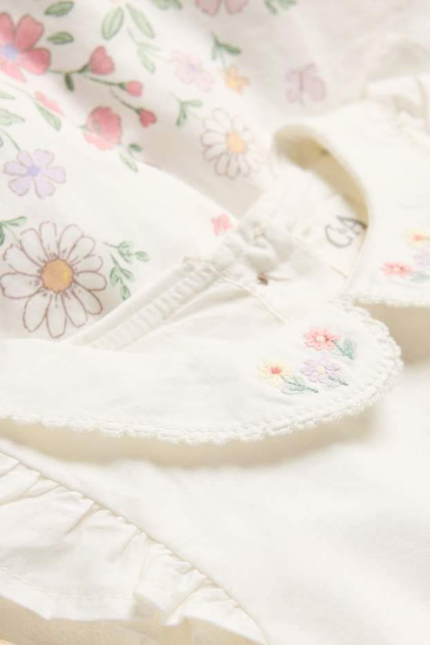 Baby: meisjes - Bloemetje - babyjurk - wit