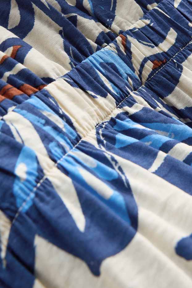 Damen - Jumpsuit mit V-Ausschnitt und Perlen - gemustert - blau / weiss