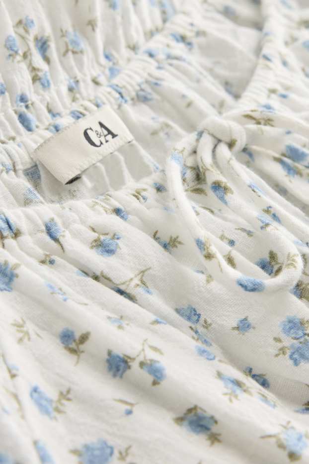 Femei - Bluză crop fără mâneci - cu flori - cu fronseuri - alb