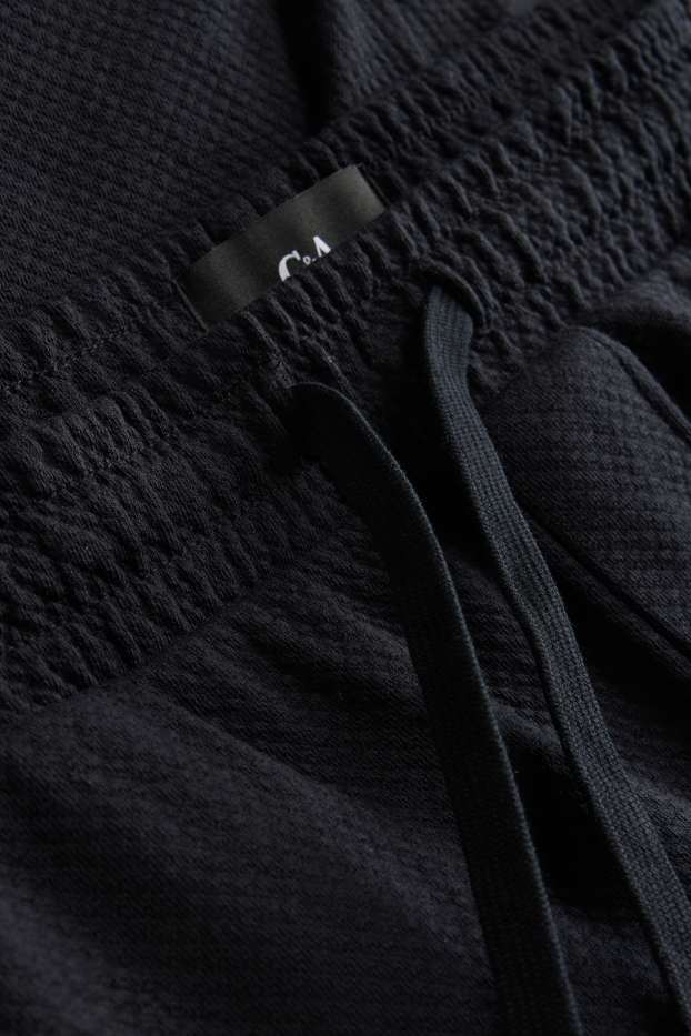 Uomo - Shorts di felpa - tessuto tramato - nero