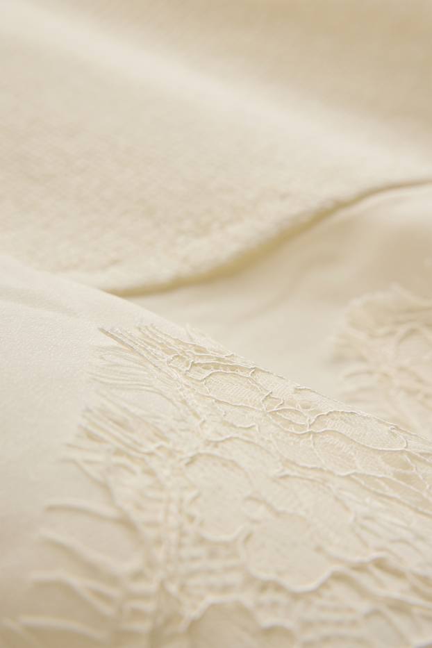 Dona - Jersei de punt - mànigues curtes - acanalat - crema